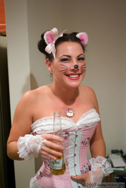 cat in hello kitty costume. Of course, if there was Hello Kitty beer, she would be doing it with that, 