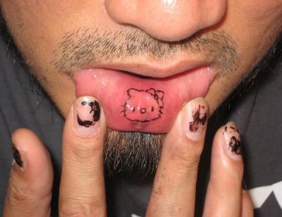 a Hello Kitty lip tattoo as punishment for thinking that sending this me