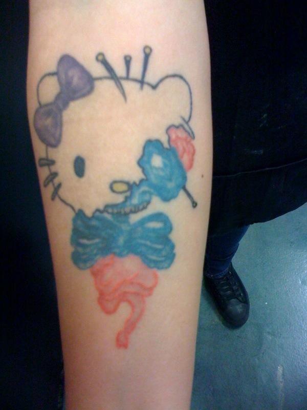 In the never ending stream of Hello Kitty tattoos that make you say “wtf was 